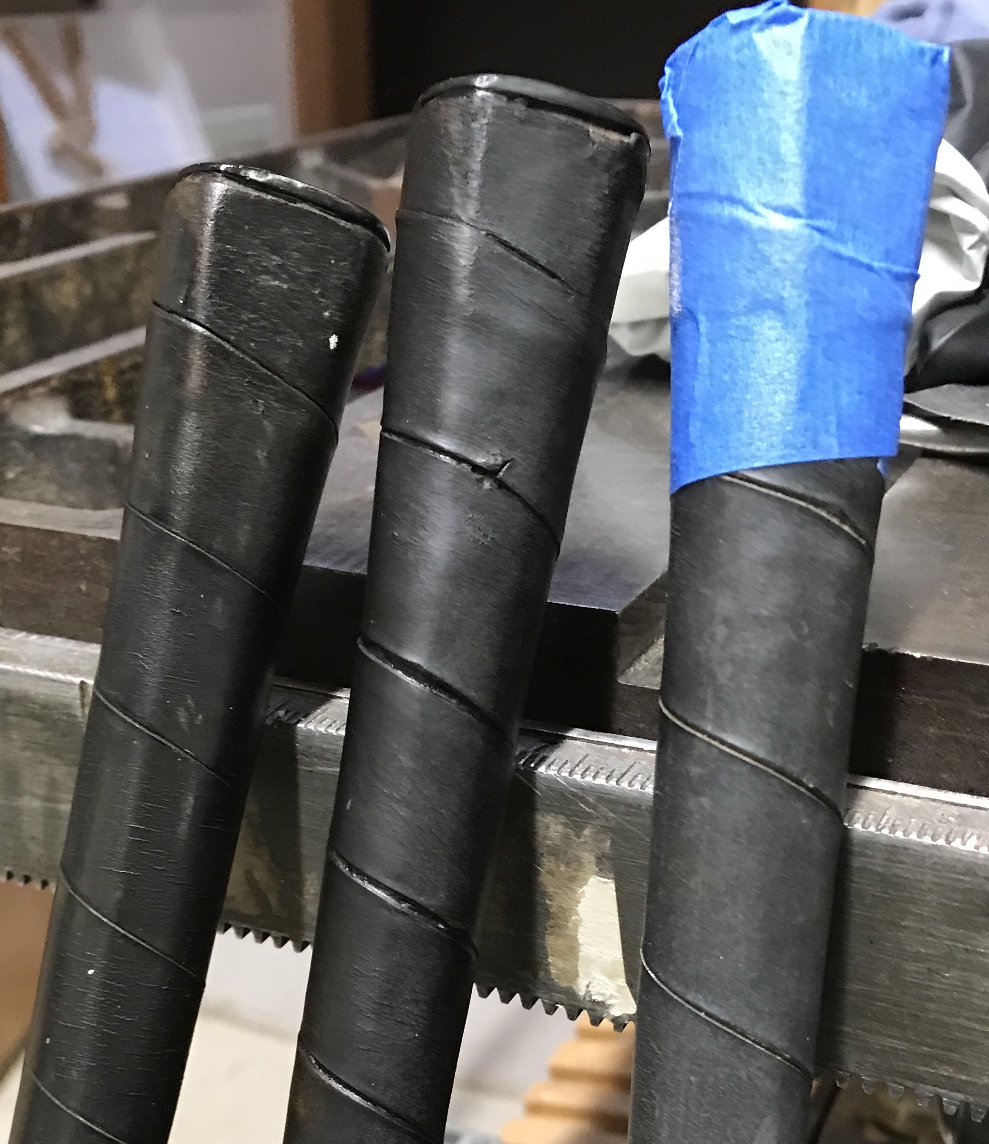 Two leather grips treated with shoe polish